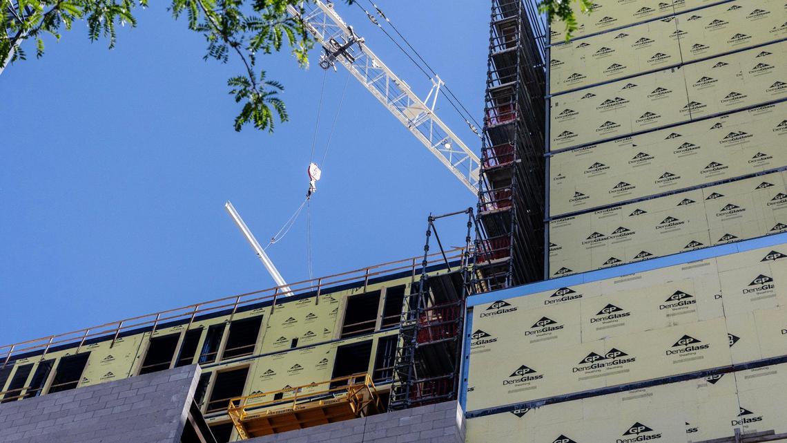The final beam is lifted by the crane during the topping out ceremony for the dual Marriott AC and Element hotels building in June.