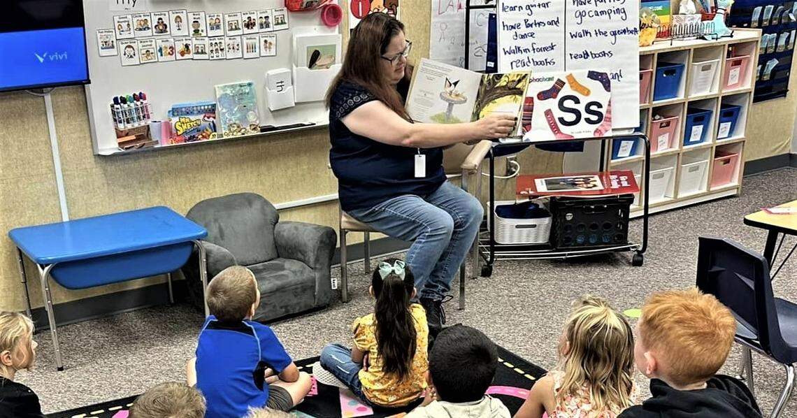 Kuna School Board vice chair Joy Thomas reads Skippyjon Jones, a children’s picture book, to a kindergarten class at Hubbard Elementary School on Sept. 15.