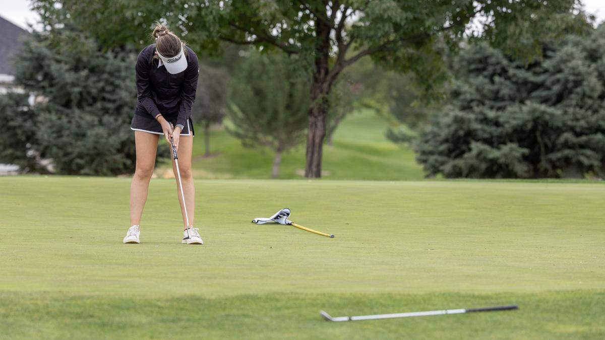 Bishop Kelly's Cara Carter putts on No. 4 during the 5A District Three Golf Tournament held at TimberStone Golf Course in Caldwell, Wednesday, Oct. 1, 2025.