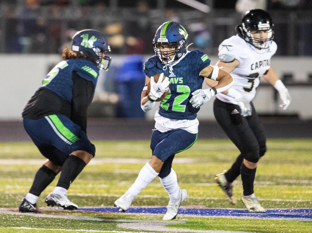 Mountain View running back Dallas Slocum finds a running lane in the second half Friday against Capital.