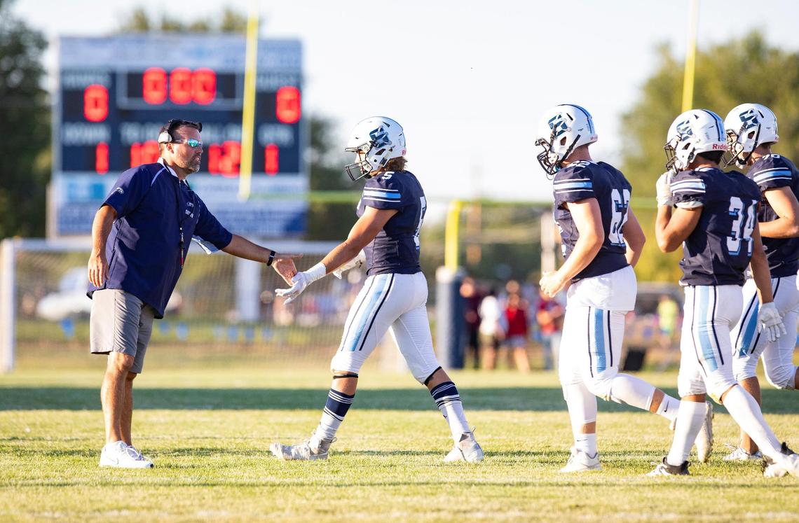 Skyview football coach David Young, left, resigned Friday after 20 seasons leading the Hawks.