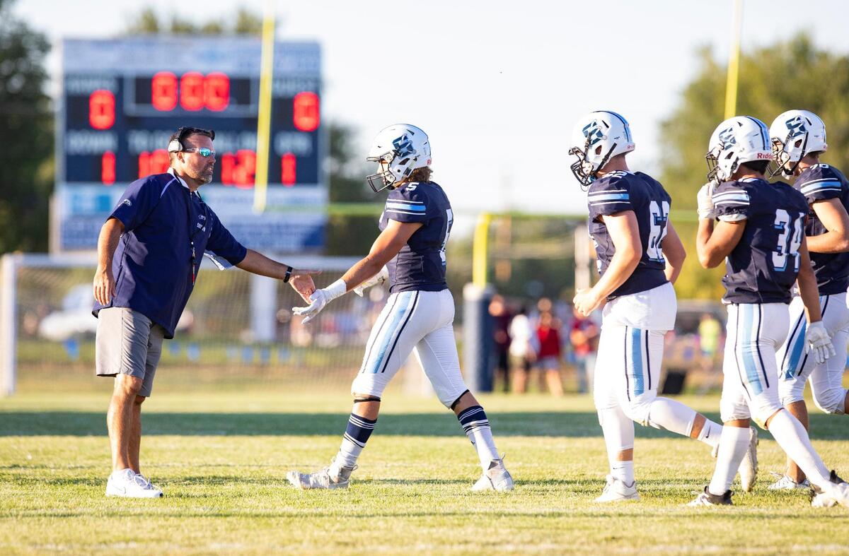 Skyview football coach David Young, left, resigned Friday after 20 seasons leading the Hawks.