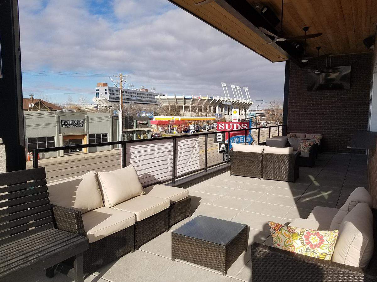 Seating on the patio of The James bar has a view of Albertsons Stadium.