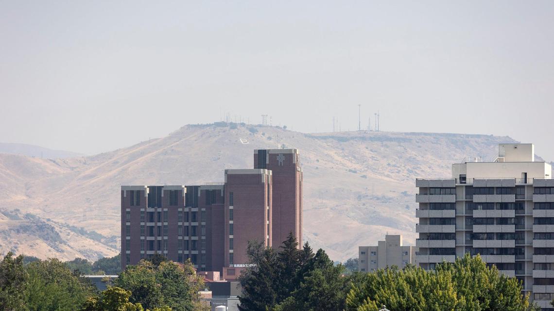 The view east toward St. Luke’s hospital in downtown Boise and Table Rock gets smoky on Thursday.