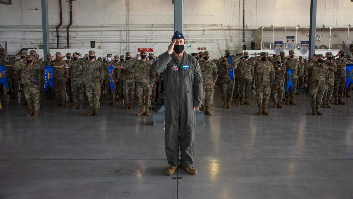 U.S. Air Force Col. Luke Teel, 366th Fighter Wing deputy commander of operations, leads airmen from 366th Fighter Wing in their first salute to Col. Ernesto M. DiVittorio, on Friday, Aug. 27.