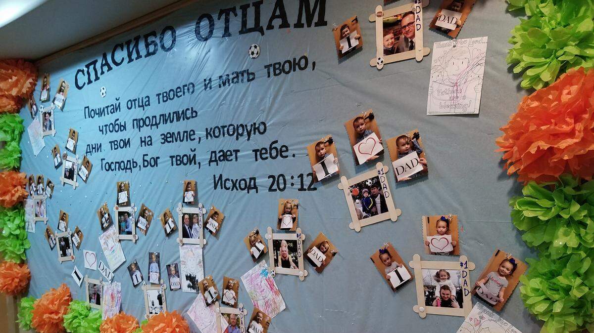 In late August 2018, this Petra Academy bulletin board held photos of students and their fathers.