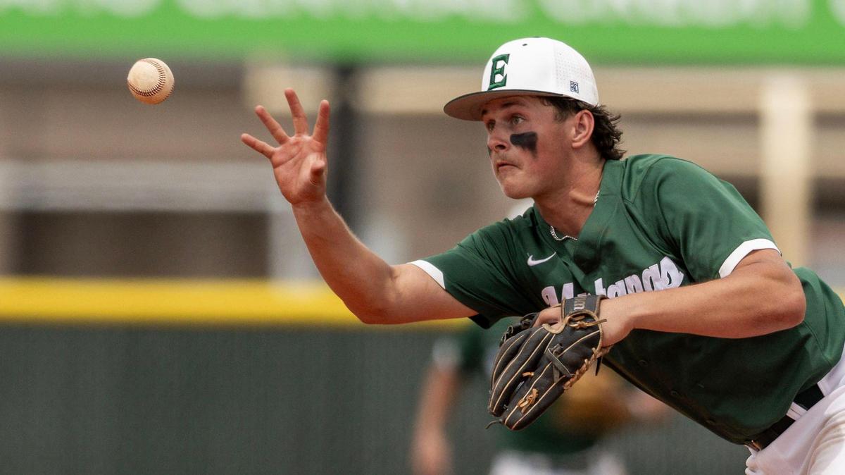 Eagle shortstop Caleb Zawadzki bare-hands a ground ball in the 6A regionals last season at Owyhee High. 