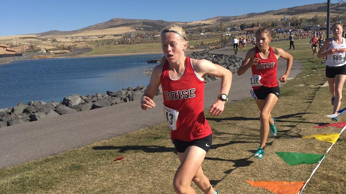 Freshmen Sammy Smith, left, and Allie Bruce helped Boise win its third straight 5A state title in cross country Friday at Portneuf Wellness Complex in Pocatello. Smith won the individual title.