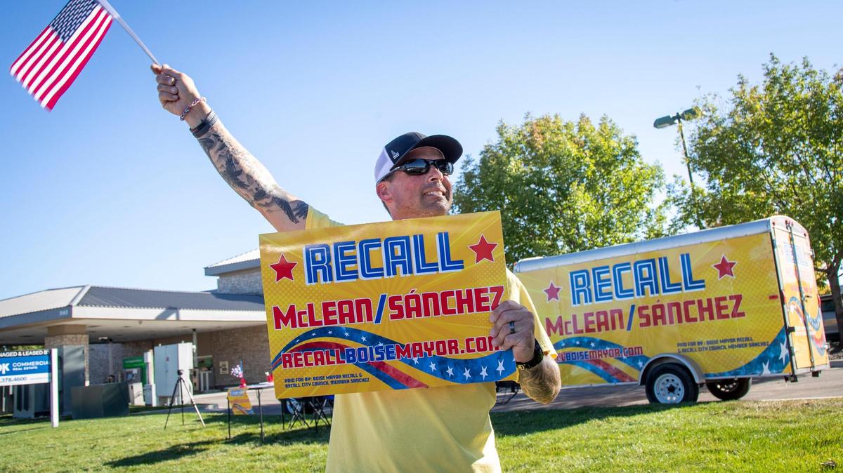 The trailer wrap was funded by donations from people supporting the effort. Newton says the coloring — blue and red text on a yellow background — is intended to imply that the recall effort is nonpartisan.