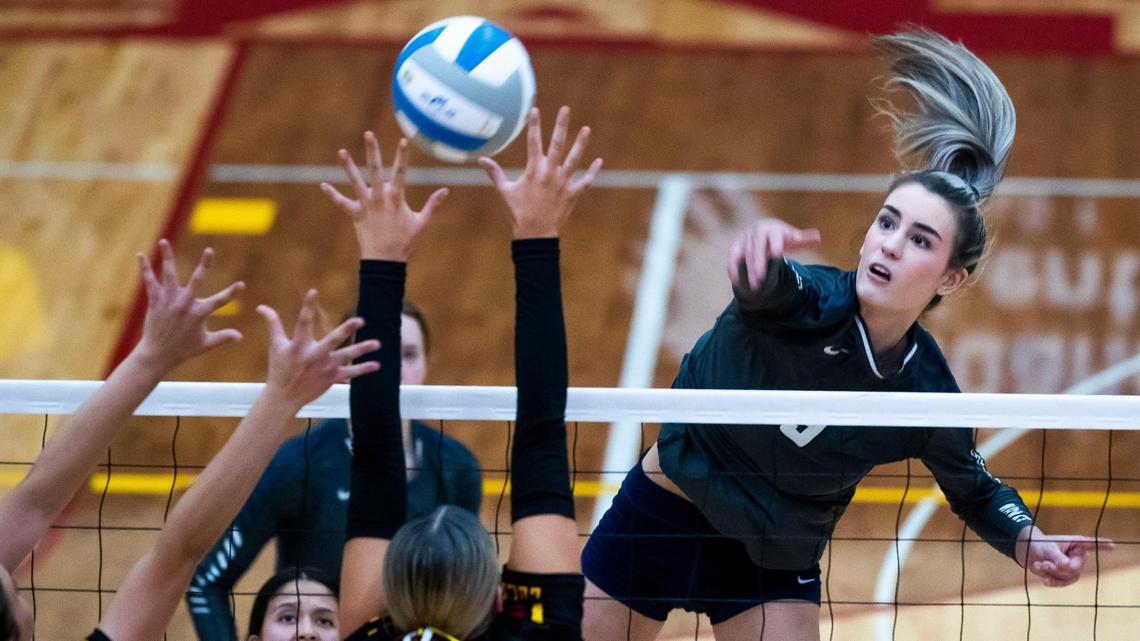 Skyview outside hitter Alex Acevedo hits through Columbia blockers during the 4A District Three volleyball championship on Wednesday at Columbia High School in Nampa. The Hawks won their 12th straight district title in a 25-17, 25-17, 25-10 sweep.