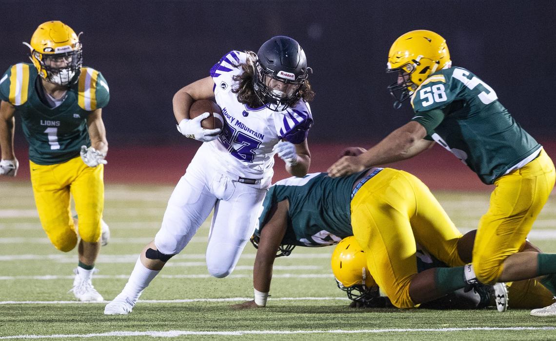 Rocky Mountain running back Devon Fox picks his way through the Borah defense last week during the Grizzlies’ season-opening win.