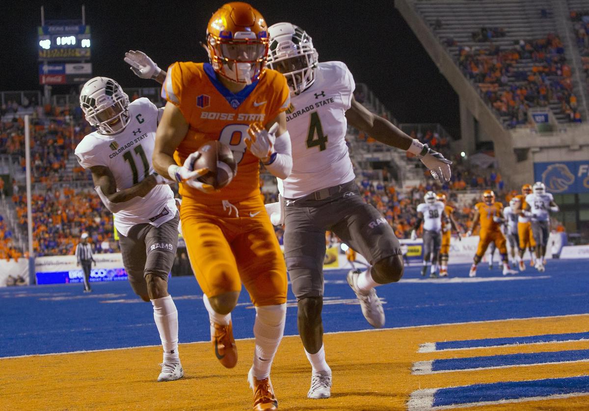 Boise State wide receiver Sean Modster beats Colorado State cornerback Rashad Ajayi (4) and safety Jordan Fogal on a touchdown pass last week at Albertsons Stadium in Boise.