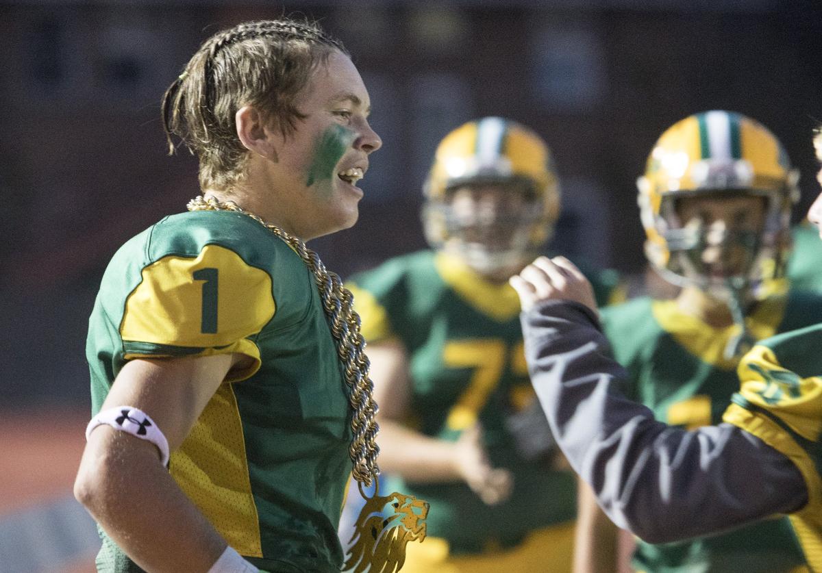 Logan Miller gets to wear Borah’s turnover chain after his third-quarter interception in a 42-25 win against Eagle on Thursday at Dona Larsen Park.