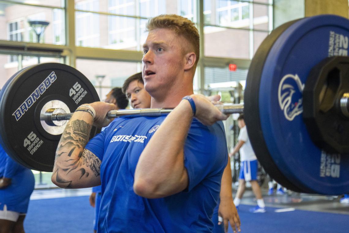 Boise State defensive lineman Chase Hatada trains in an afternoon weight workout.
