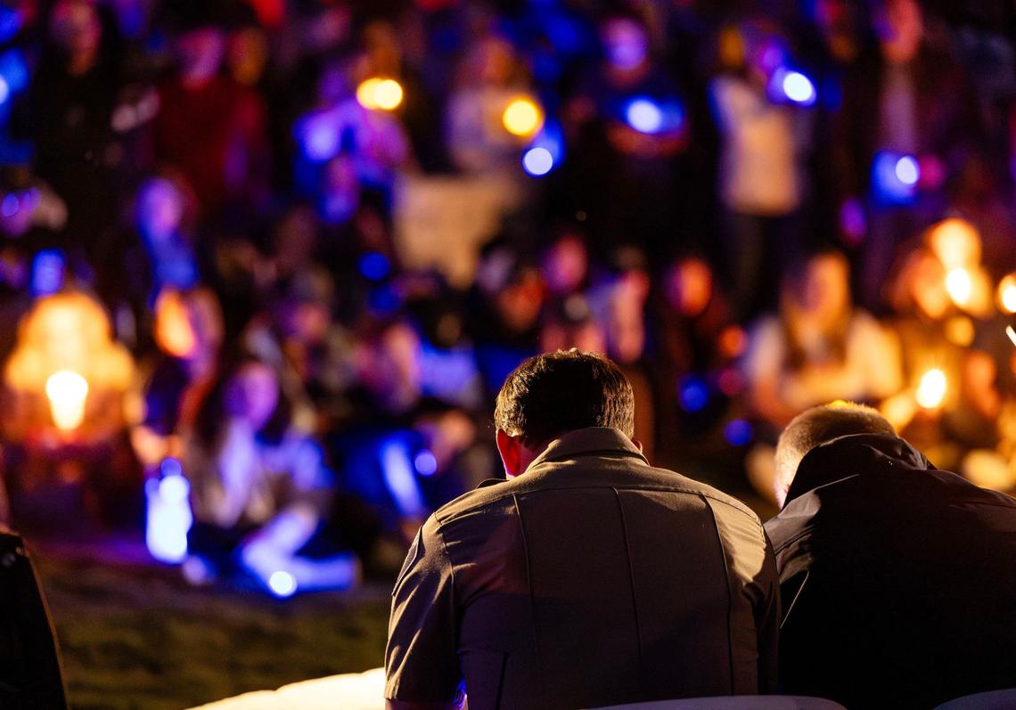 Star Mayor Trevor Chadwick, right, and Police Chief Zach Hessing observe a moment of silence during a candlelight vigil honoring Ada County Sheriff’s Deputy Tobin Bolter, who was killed in the line of duty.