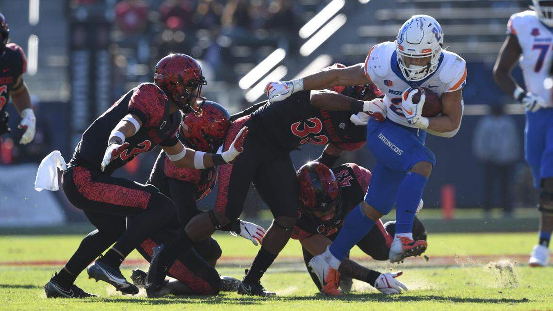 Boise State running back George Holani carries the ball in the first half of Boise State’s 27-16 loss at San Diego State on Friday. Holani had his string of 100-yard rushing games end.