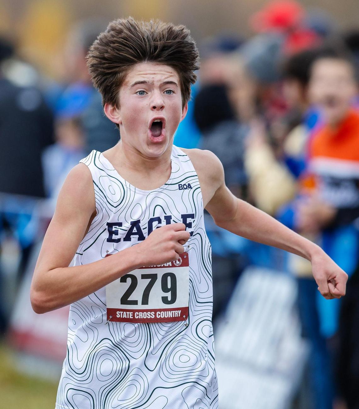 Eagle’s Johnny Culpepper reacts as he crosses the finish line at the 6A state cross country meet last season at Eagle Island State Park.