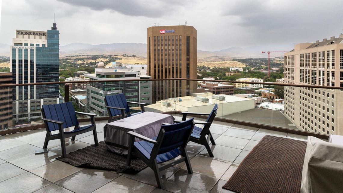 The main deck features a hot tub and patio seating.