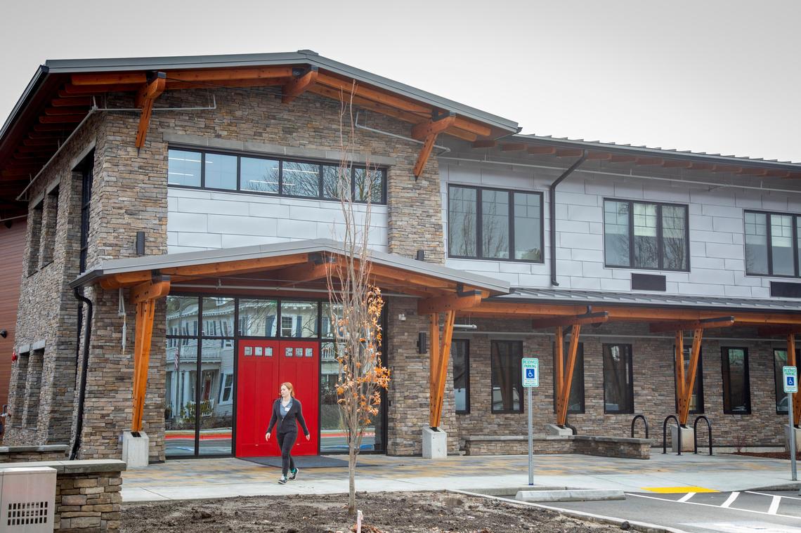 The Ronald McDonald House is moving from the historic home where it had been for 32 years, across a driveway to a newly built, larger home that can serve 47 families. The red doors at the entrance are an iconic feature also found at the old house.