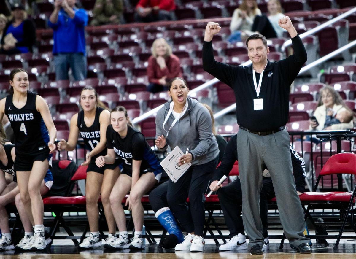 Timberline coach Andy Jones reacts to his team defeating Rigby 59-53 in the first round of the 5A girls basketball state tournament, Thursday.