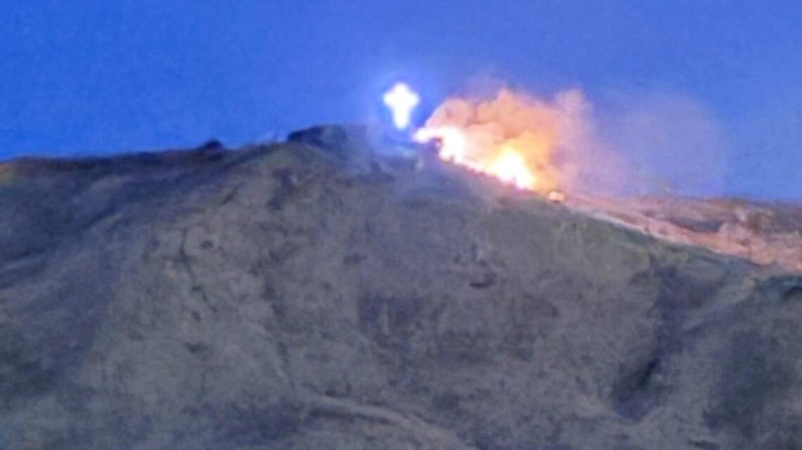 Firefighters extinguish blaze near Table Rock on Saturday night; flames seen near cross
