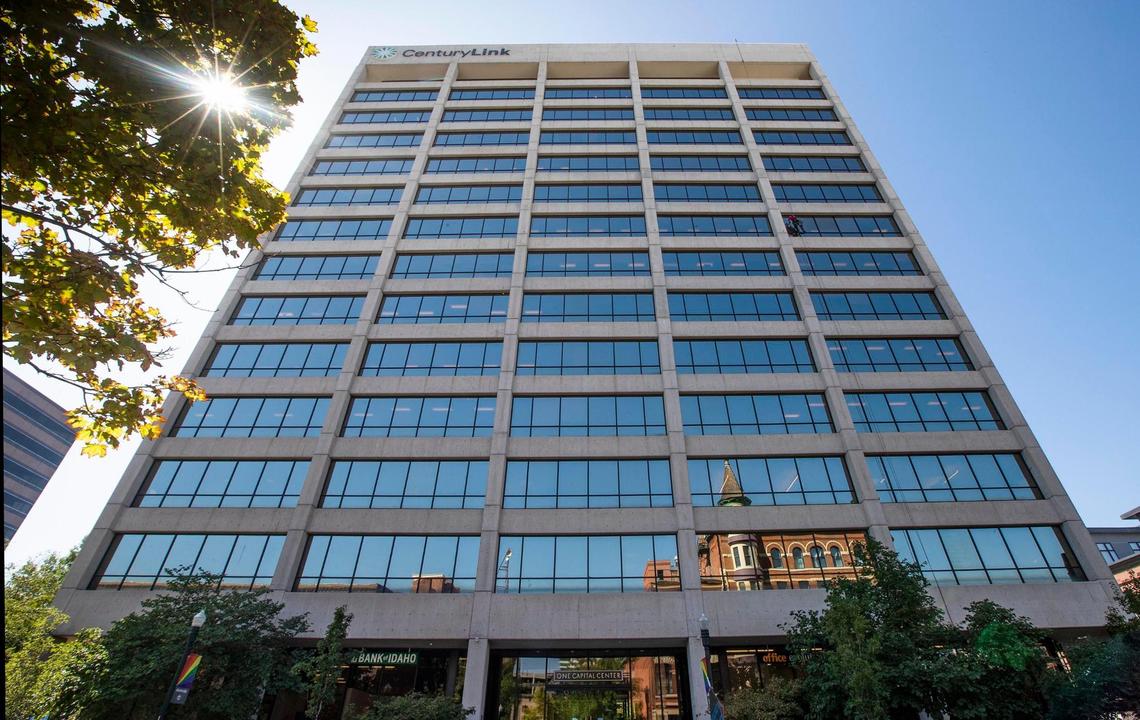 CenturyLink call center employees have worked from home during the coronavirus pandemic and now the company plans to vacate its offices at One Capital Center in downtown Boise The historic Idanha Hotel is visible in the reflection.
