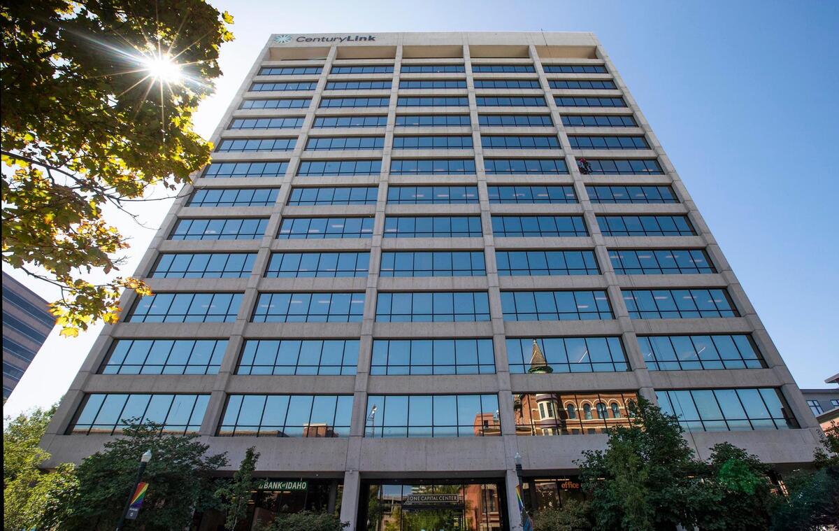 CenturyLink call center employees have worked from home during the coronavirus pandemic and now the company plans to vacate its offices at One Capital Center in downtown Boise The historic Idanha Hotel is visible in the reflection.