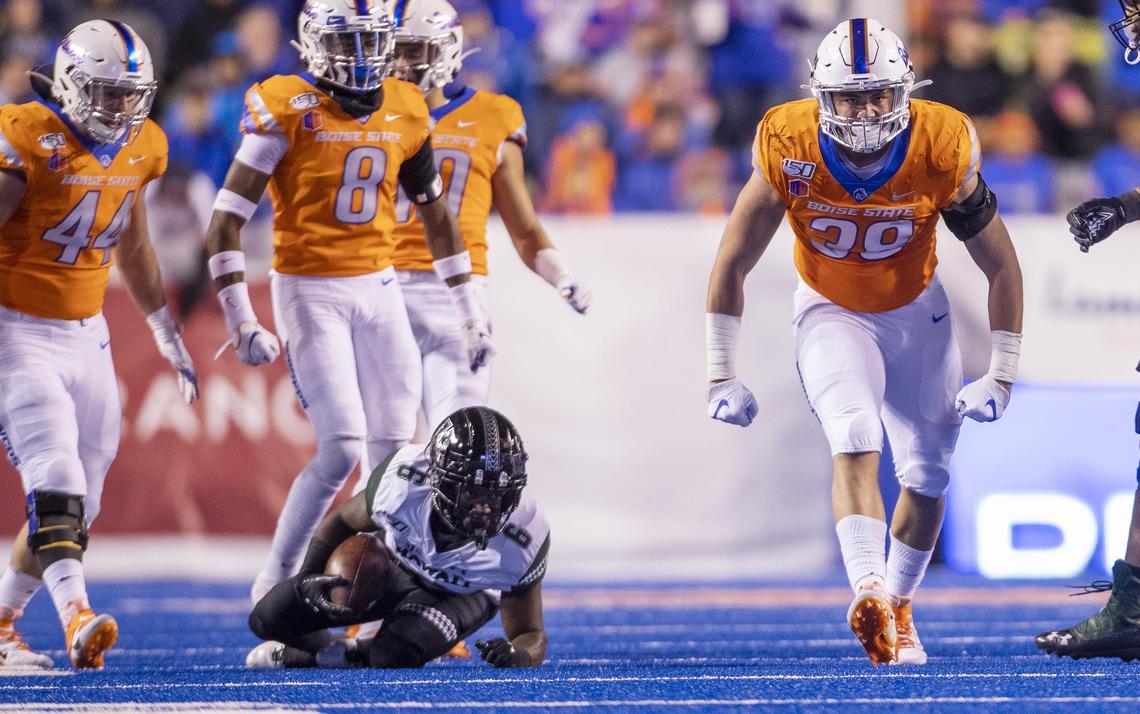 Boise State defensive STUD Demitri Washington flexes after a hard tackle on Hawaii wide receiver Cedric Byrd II in the third quarter on Saturday at Albertsons Stadium in Boise.