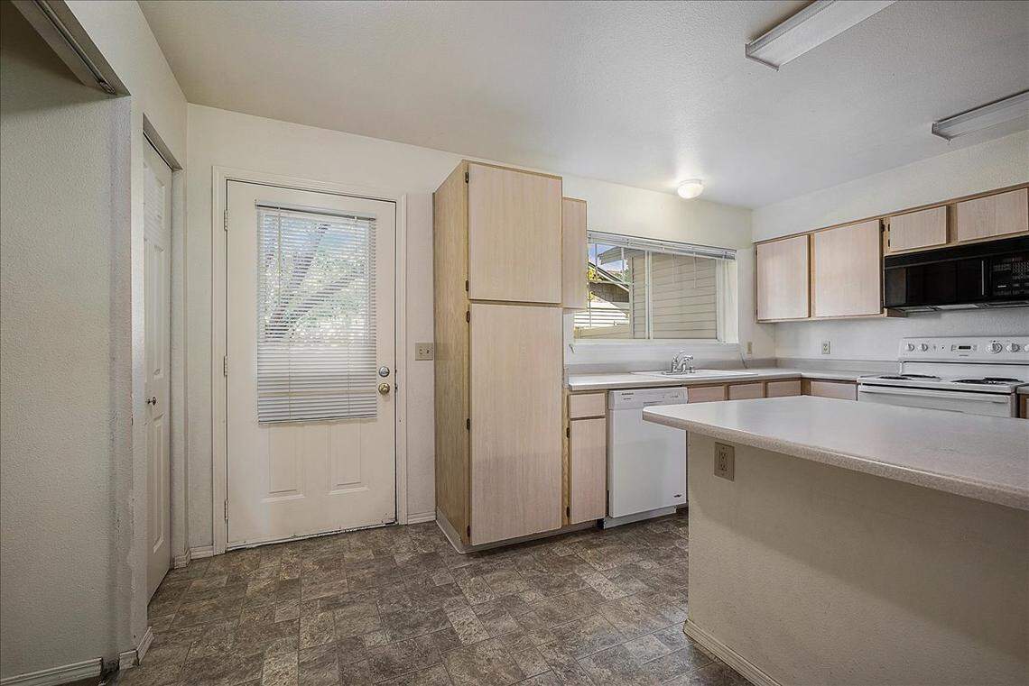 The condo at 2752 W. Cherry Lane includes a pass-through kitchen with a pantry and breakfast bar on the first floor.