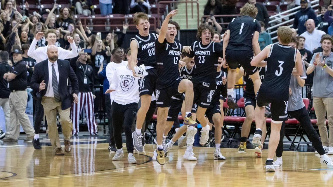 Centennial celebrates after upsetting No. 1-seed Lake City 72-67 in the opening round of the 5A boys basketball state tournament Thursday at the Ford Idaho Center in Nampa.