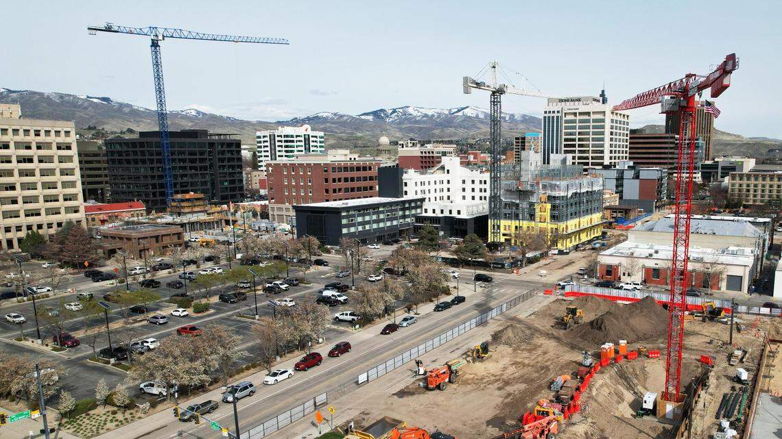 Three cranes work on the construction of new buildings in downtown Boise, Thursday, April 20, 2023. 13th Street from Myrtle Street to Front Street and the adjacent block of Front Street to Grove Street is closed for overhead and underground infrastructure work.