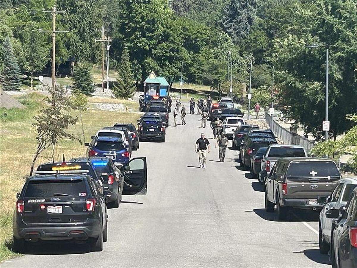 Emergency vehicles near Coeur d’Alene on Sunday afternoon after an ambush on Canfield Mountain. Kootenai County Commissioner Bruce Mattare has pushed back on some national outlets’ speculation that the attack was connected to white nationalism.