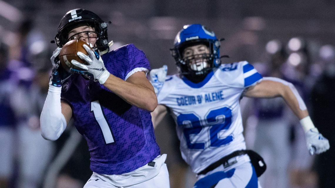 Rocky Mountain senior Jordan Erickson catches a 75-yard pass in full stride on his way to the Grizzlies’ first score defended by Coeur d’Alene’s Ty Pottenger. The pass by quarterback Kobe Warr was one of three touchdown throws in Rocky’s 36-21 victory in the 5A state football semifinals Friday, Nov. 13, 2020, in Meridian.