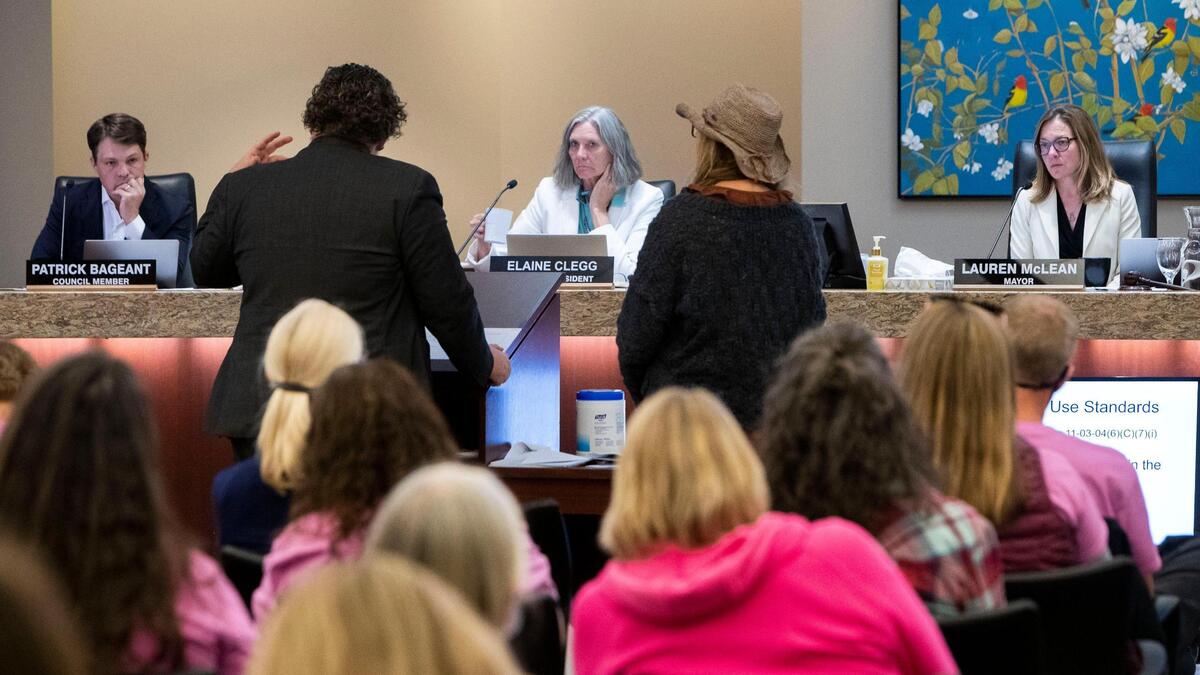 The Boise City Council listens to testimony from Interfaith Sanctuary Executive Director Jodi Peterson-Stigers and legal counsel Geoff Wardle during the hearing Monday.