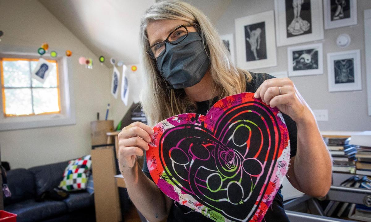 Printmaker Wendy Blickenstaff prints, like this one called “No. 43 Agape,” messages of hope during the stay-at-home order. “I’m going to keep going until everything’s on track,” she says. “I think I’m going to be making COVID prints until we have a vaccine.”