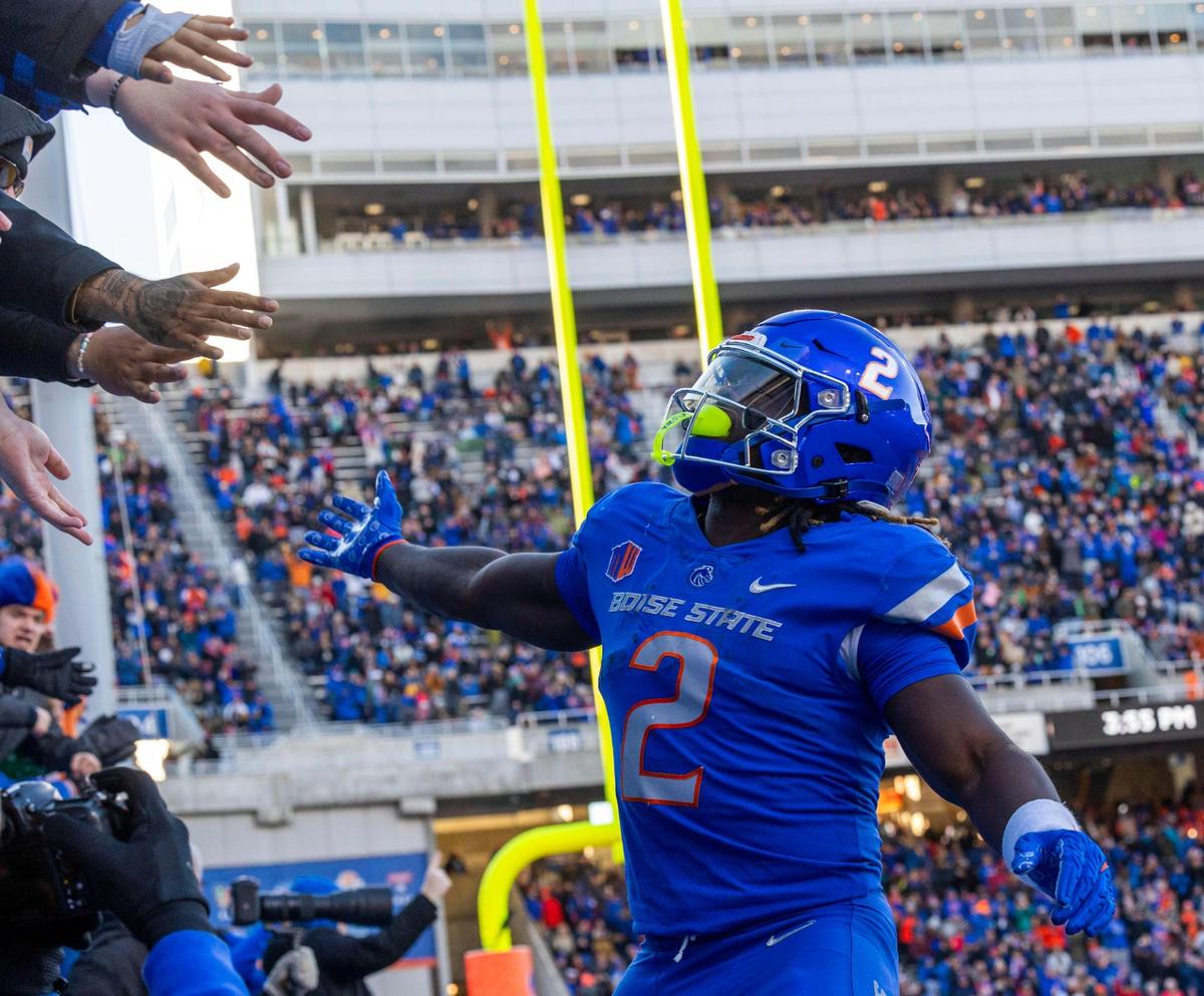 Boise State running back Ashton Jeanty celebrates with fans after a touchdown last season at Albertsons Stadium.