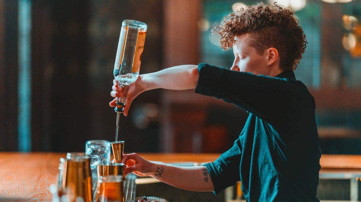 Bartender Morgan Weeber makes a drink at Western Proper, which recently updated its signature cocktail menu for spring and summer.