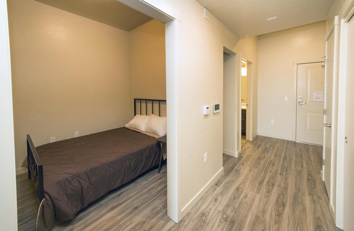 Each unit at New Path Community Housing provides typical apartment amenities like a kitchen, bathroom, bedroom and living room.