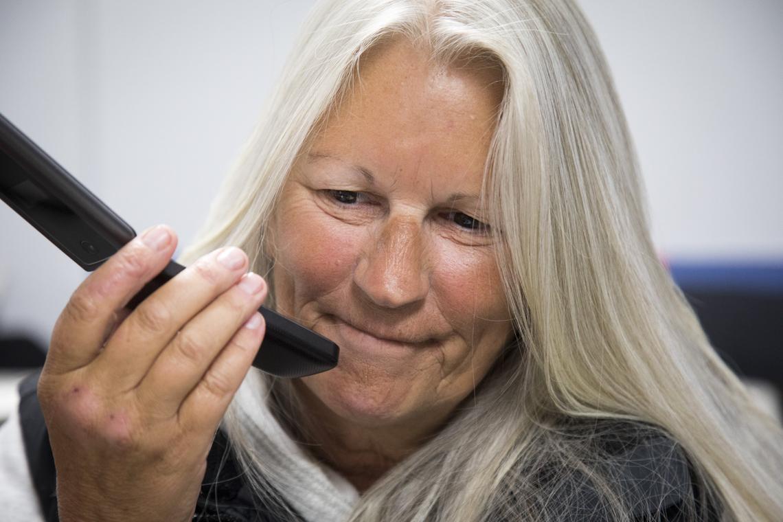 Traci Foy talks with Lawrence Shapiro on a cell phone that he helped her get. Shapiro has become an important point of contact outside the Interfaith Sanctuary homeless shelter and provides moral support, and occasional transportation and meal out.