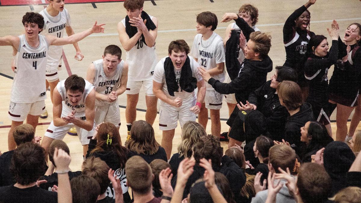 The Centennial boys basketball team celebrates its 60-46 win over Meridian on Friday.
