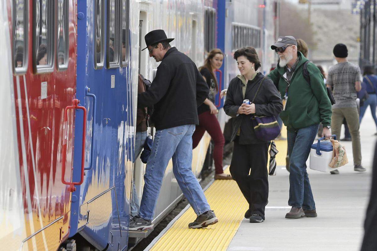 Commuters board the “Frontrunner’” commuter rail line after arriving at a Salt Lake City train station in 2014. Treasure Valley transportation agencies have studied the possibility of a commuter-rail system using existing railroad tracks between Boise and Caldwell.