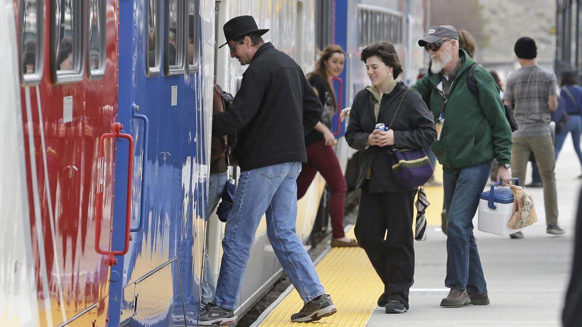 Commuters board the "FrontRunner'" commuter rail line after arriving at a Salt Lake City train station in 2014. The FrontRunner offers a good model for what commuter rail might look like in the Treasure Valley.