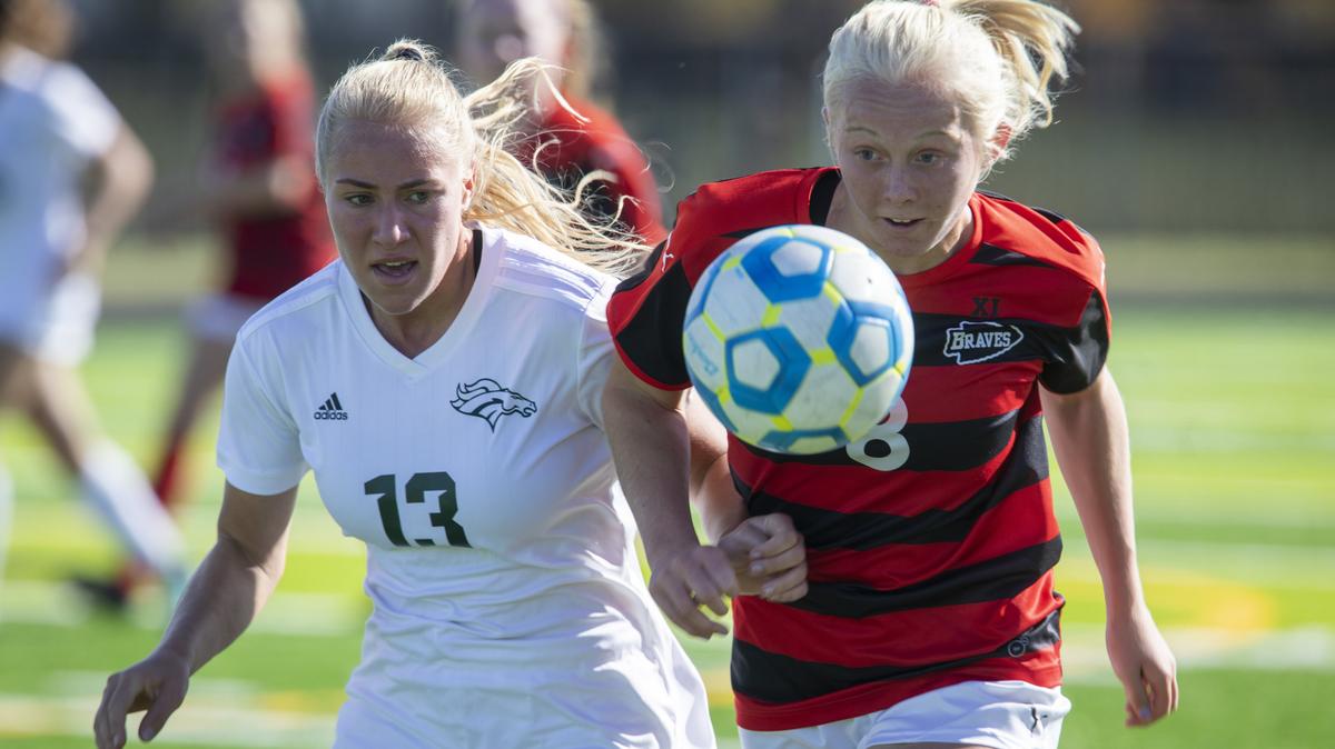 Eagle’s Kody Epp, left, tries to get the ball back from Boise’s Logan Smith during the first round of the 5A state tournament Thursday at Rocky Mountain High. Boise beat Eagle 2-0 to advance to the semifinals.