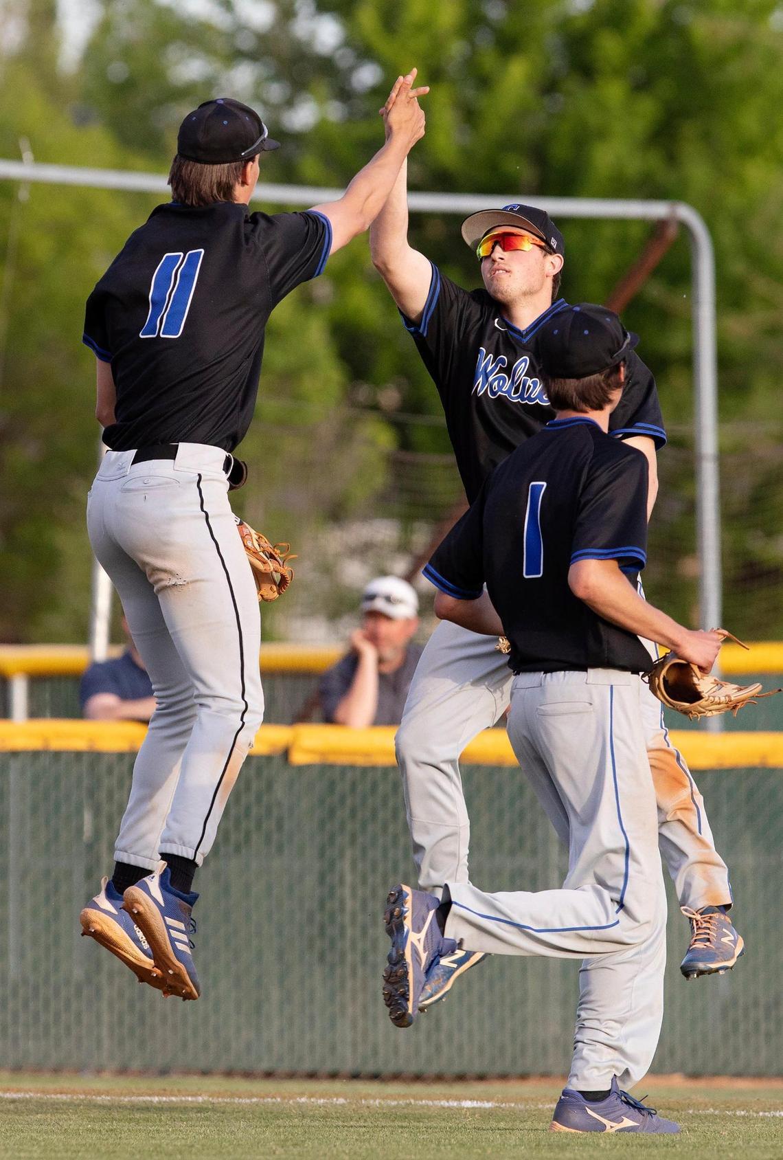 Timberline’s Greyson Shafer, left, and Max Spielman high five as they clinch the Wolves’ first district baseball title since 2013 Wednesday at Rocky Mountain.