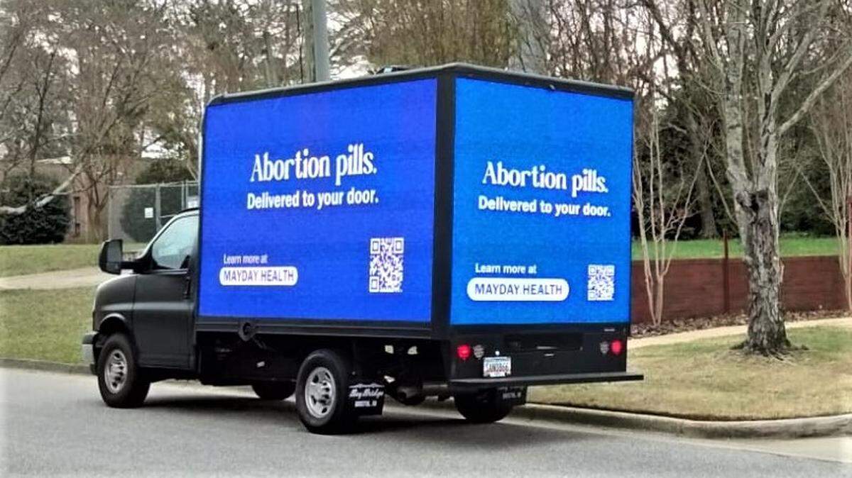 A mobile billboard truck with messages promoting abortion access for nonprofit Mayday Health was stopped by a code compliance officer Thursday.