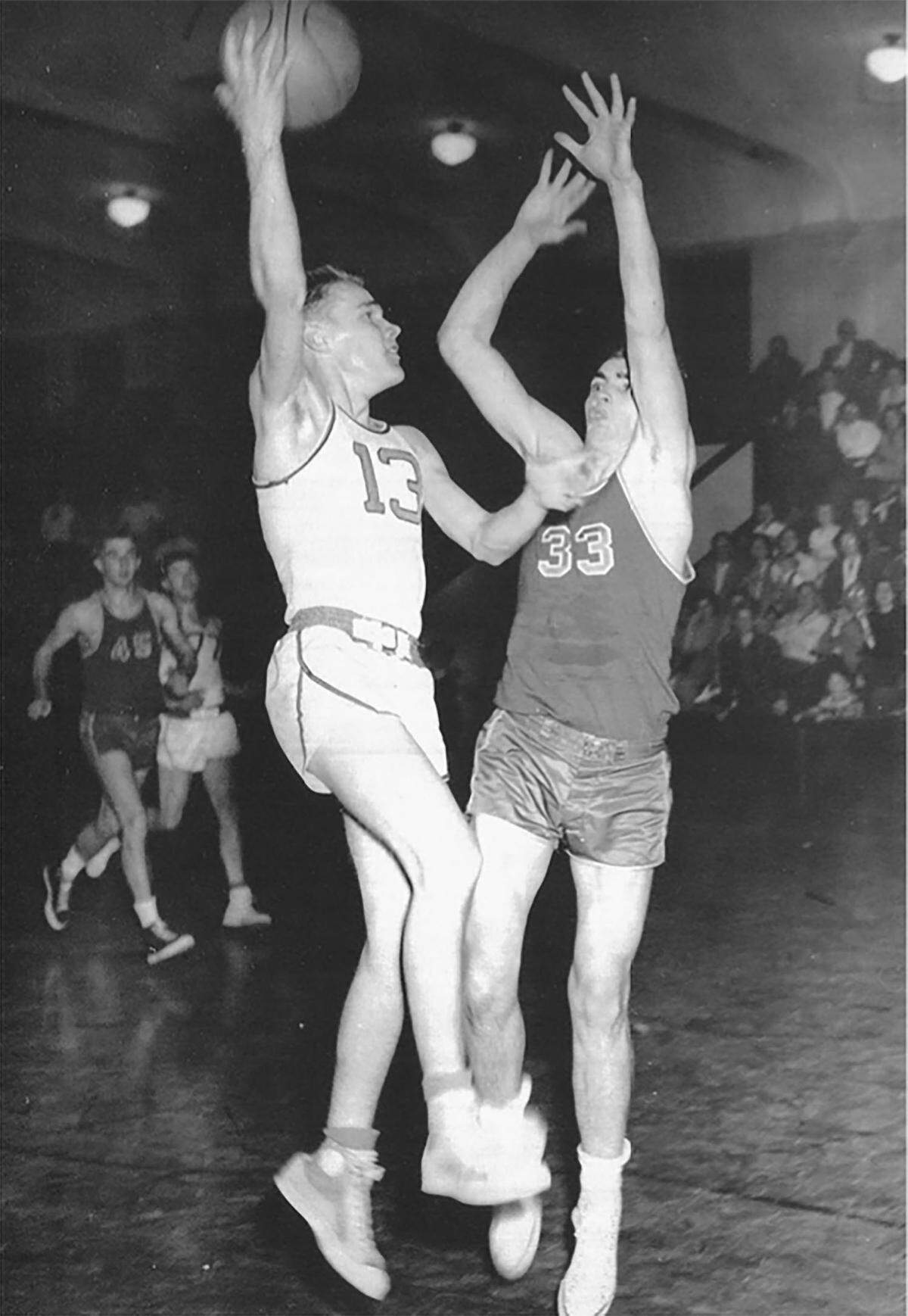 According to Northwest Nazarene’s 1953 yearbook, captain Myron Finkbeiner, left, “has the unusual knack of scoring from anywhere on the court and in any position.” Finkbeiner, who founded the World Sports Humanitarian Hall of Fame, died on June 27, 2021, at the age of 88.