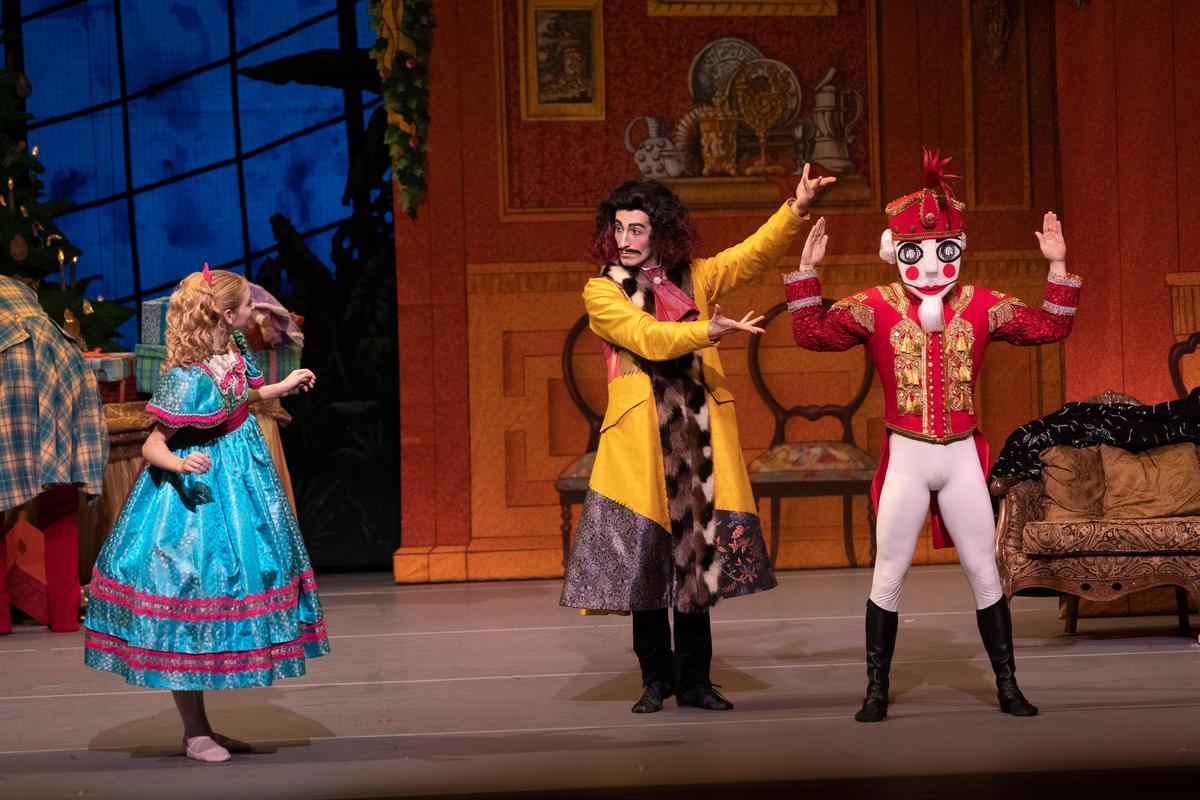 Herr Drosselmeyer (Daniel Ojeda) gives Clara the Nutcracker Doll as a gift. Ballet Idaho’s new production of “The Nutcracker,” opened Thursday.