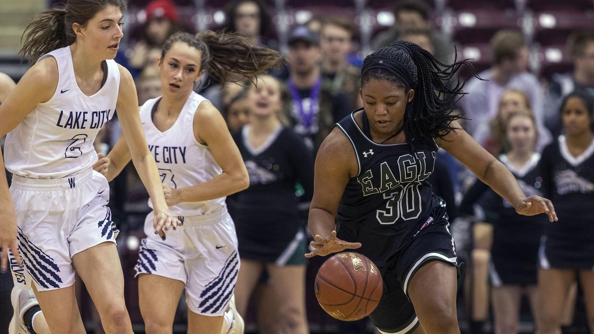 Jaimee McKinnie, right, was one of two Eagle seniors selected to the state all-star basketball game at North Idaho College.