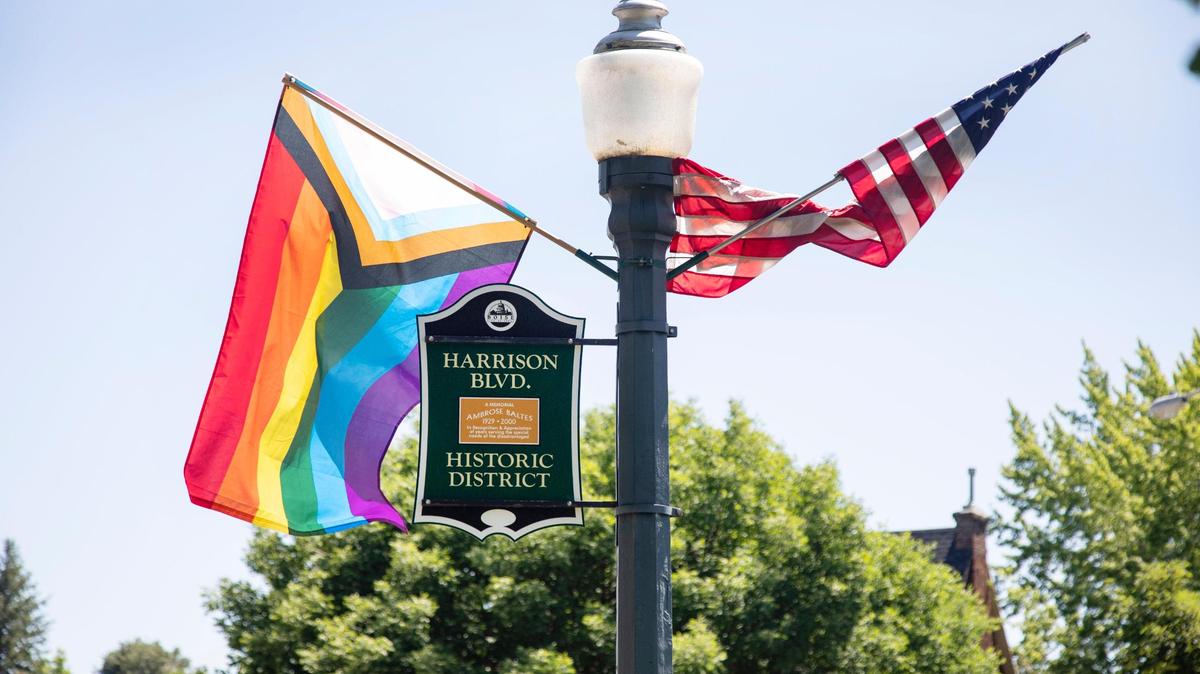 A Pride flag flies alongside an American flag on Harrison Boulevard in Boise.