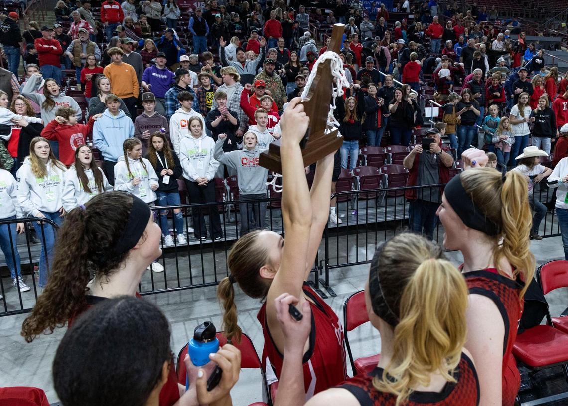 Council’s Rhianna Iveson lifts the 1A Division II state championship trophy last year at the Ford Idaho Center in Nampa.